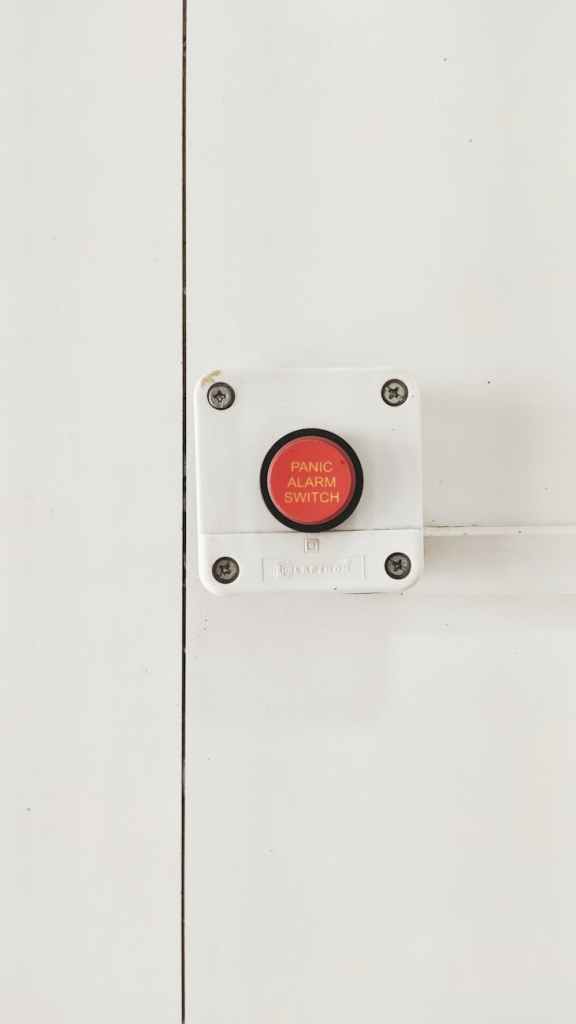 white and red panic alarm switch