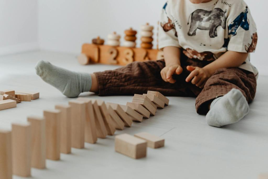 boy playing with toy blocks